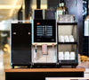 Melitta XT8 Coffee Machine with cup warmer and milk cooler on a counter in a cafe